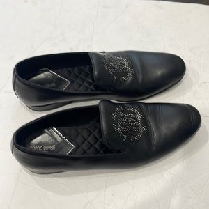 A used black Roberto Cavalli men leather shoe with embellished logo at the vamp.
